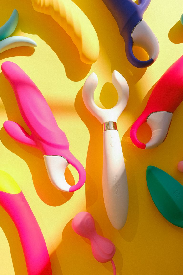 Various silicone sex toys displayed on a vibrant yellow background.
